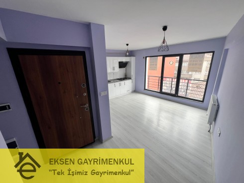 ERDEMİR CADDESİ ÜZERİNDE SIFIR AYARINDA KİRALIK  1+1DAİRE
